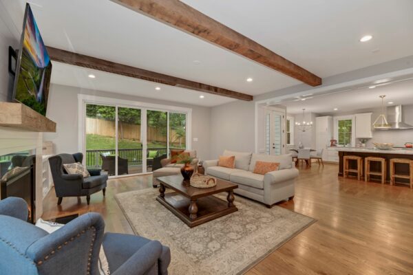 family room with exposed wood beams